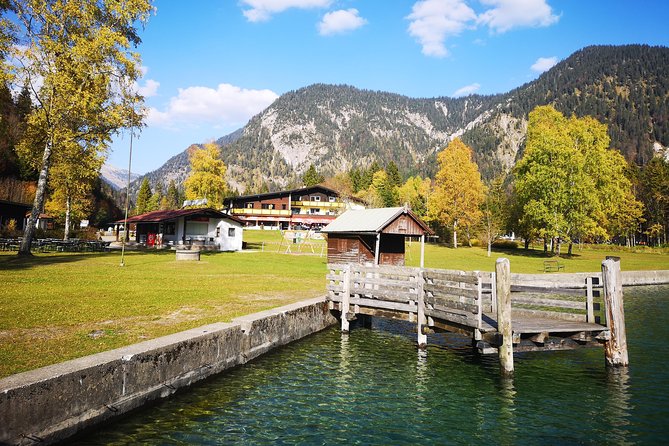 Munich private Car & Walking Tour incl. BMW World & River Surfers - Linderhof Castle gardens, alpine slides, and coaster energy