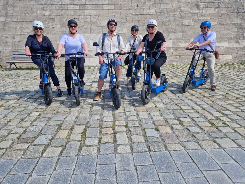 Munich: Top Sights Guided E-Scooter Tour - Siegestor and Eisbachsurfer: Munich After the Royal Chapter