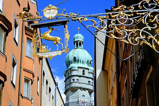 MY <em> GUiDE EXCLUSiVE PANORAMA alpine tour to INNSBRUCK (/ Swarovski) from Munich – Nordkette cable car plus Bergisel ski jump: views with modern architecture’ /><br />
If you choose to add it, Nordkette is one of those “I’m glad I did it” upgrades. You’ll reach <strong>2,269 m</strong> above sea level via <strong>Innsbrucker Nordkettenbahnen</strong>, with intermediate stops at <strong>Hungerburg (858 m)</strong> and <strong>Seegrube (1,905 m)</strong>. The stop timing here is <strong>about 1 hour 30 minutes</strong>.</p>
<p><p>Here’s the architecture hook: the grand station buildings of the first section were designed by <strong>Zaha Hadid</strong>, nicknamed the Curved Queen. The tour info also credits her for the <strong>Bergisels Hill</strong>. If you care about modern design, this is a rare chance to see world-famous architecture not in a city museum, but in an alpine transport system with real mountain views.</p>
</p>
<p><p>The Nordkette ticket cost is <strong>not included</strong>. The tour states 2025 <strong>round trip prices</strong> start at <strong>€13 for adults</strong> and <strong>€7.80 for children (7–16)</strong>.</p>
</p>
<p><p>Then you move on to the <strong>Bergisel ski jump</strong>, which the tour info frames as an Olympic past viewpoint with modern architecture. You’ll get the idea of why it’s famous: it’s not just a ski site; it’s an angle onto Innsbruck itself, plus another <strong>Zaha Hadid-designed</strong> element through the tower.</p>
</p>
<p><p>Small drawback to plan for: altitude means weather changes faster. If clouds roll in, the cable car still delivers the architecture and the experience, but views can fade.</p>
</p>
<h2 id="mittenwald-postcard-town-details-violin-making-and-an-optional-karwendel-ride">Mittenwald: postcard town details, violin making, and an optional Karwendel ride</h2>
<p><img width="668" height="446" decoding="async" src=