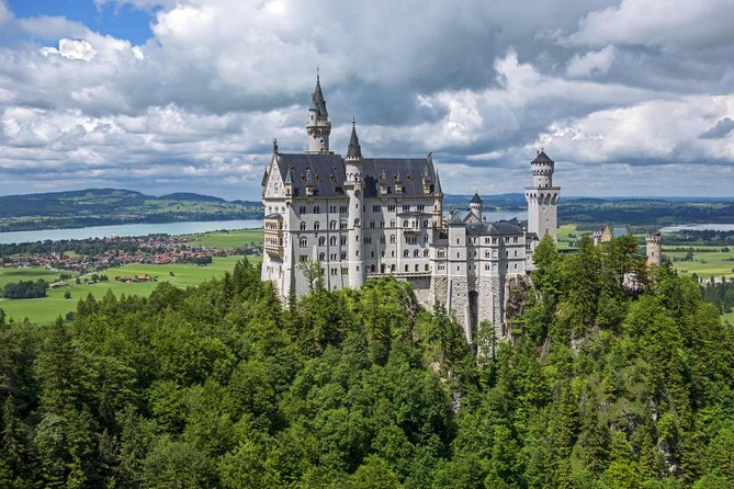 MY<em>GUiDE The King's GREATEST PALACES Neuschwanstein & HERRENCHIEMSEE from Munich – Key points that matter before you go’ /></p>
<ul>
<li><strong>Skip-the-line for Neuschwanstein is included</strong> so even last-minute bookings can still save you time at the busiest site.</li>
<li><strong>Herrenchiemsee is a guided “Versailles” interior</strong>, plus your ticket covers the Ludwig II Museum and the Old Palace areas.</li>
<li><strong>Your day is paced with scenic drives and smart stops</strong>, not just time stuck waiting in transit.</li>
<li><strong>Stefan’s team runs the show with a licensed guide</strong>, and the historical narration isn’t limited to castles.</li>
<li><strong>You get a comfort-first private vehicle</strong> (new Mercedes or VW minivan, A/C, mineral water).</li>
<li><strong>Budget for extras</strong>: Herrenchiemsee entrance and the Lake Chiemsee ferry aren’t included in the base price.</li>
</ul>
<h2 id="munich-morning-start-and-the-private-van-feel">Munich morning start and the private van feel</h2>
<p><img width="670" height="446" decoding="async" src=